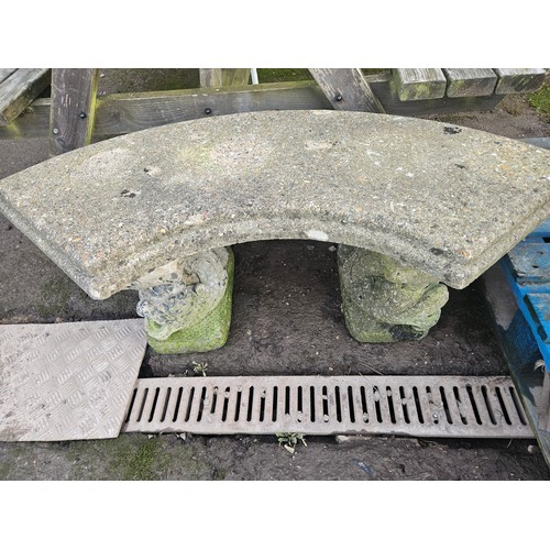 2928 - A weathered concrete bench on 2 decorative plynths