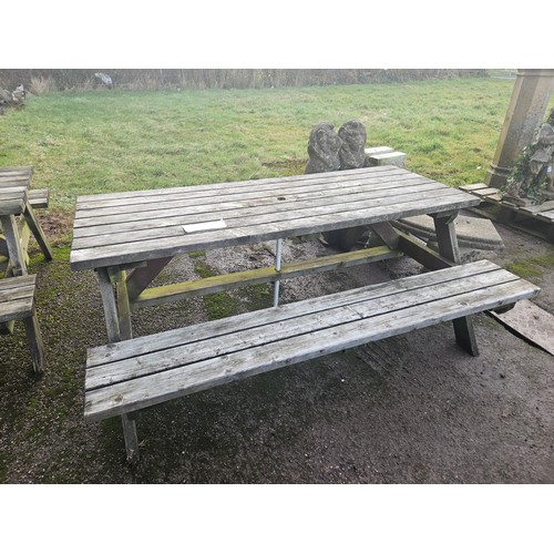 2933 - A wooden picnic table with fitted benches