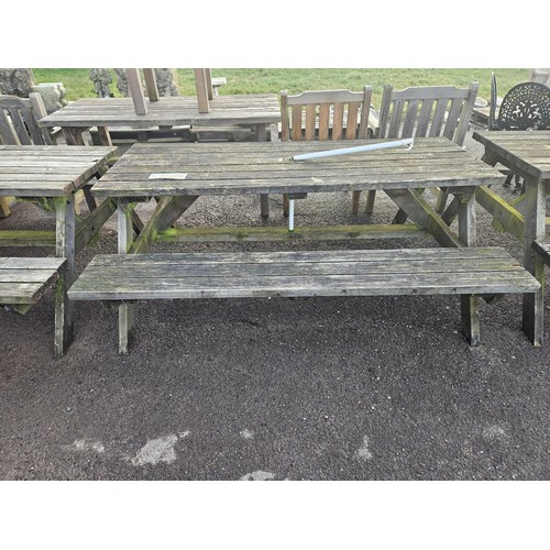 2935 - A wooden picnic table with fitted benches