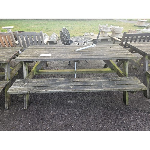 2936 - A wooden picnic table with fitted benches