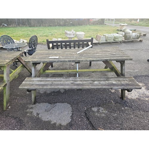 2937 - A wooden picnic table with fitted benches