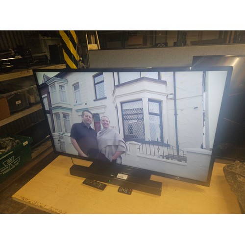 2769 - A 50 inch HDTV by Bush type DLED50265FHD, comes with stand, bush sound bar and 2 remote controls - t... 