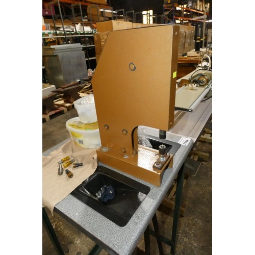 2184 - A foot operated eyelet press machine with stand, various tooling and accessories