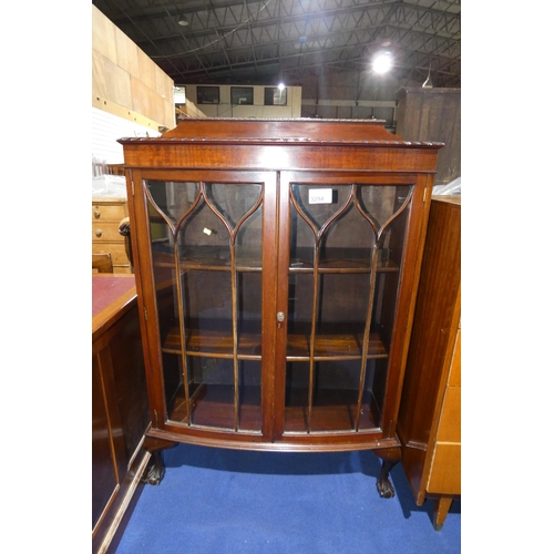 3294 - A mahogany bowfront display cabinet with two glazed doors enclosing shelves, approximately 95 cm wid... 