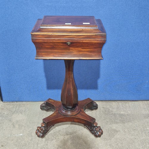 3366 - A Victorian sarcophagus shaped mahogany teapoy/workbox with a lift lid enclosing a fitted interior, ... 