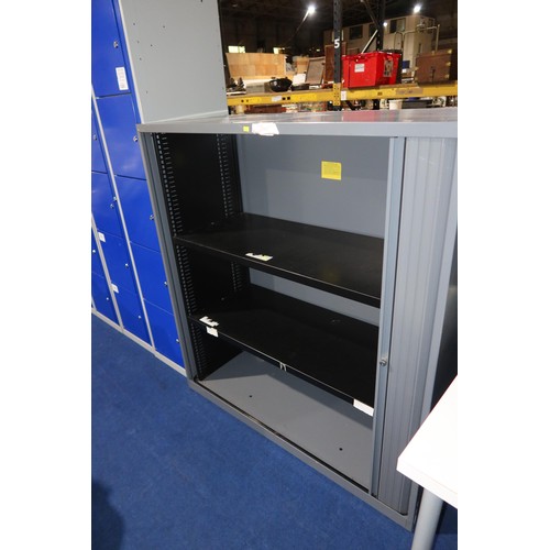 1324 - 1 x grey metal tambour front storage cabinet approx 120 x 47 x 139cm high. Please note that the left... 