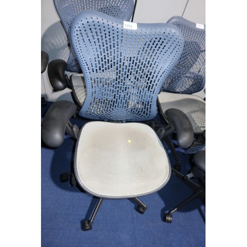 1372 - 1 x Herman Miller Mirra office swivel chair with grey mesh seat and dark blue plastic back