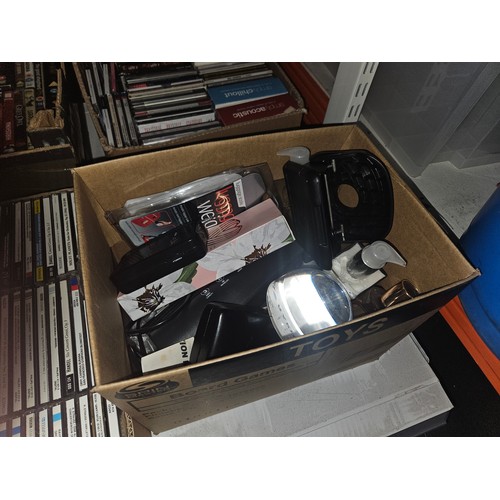 2630 - A quantity of various items including CDs & books etc. Contents of 3 shelves