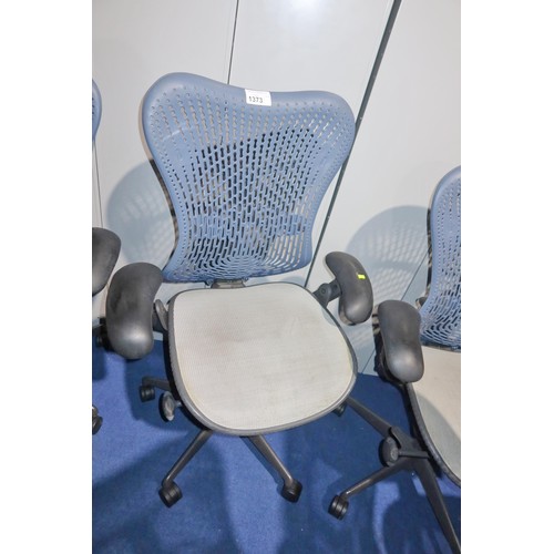 1373 - 1 x Herman Miller Mirra office swivel chair with grey mesh seat and dark blue plastic back