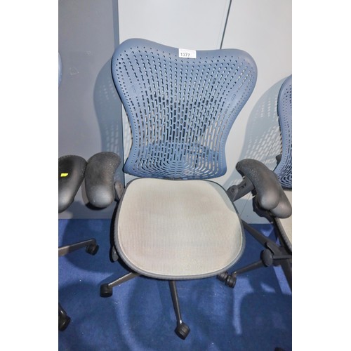 1377 - 1 x Herman Miller Mirra office swivel chair with grey mesh seat and dark blue plastic back