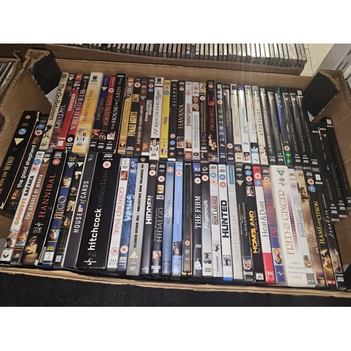 2638 - A large quantity of various DVDs and CDs, contents of 3 shelves