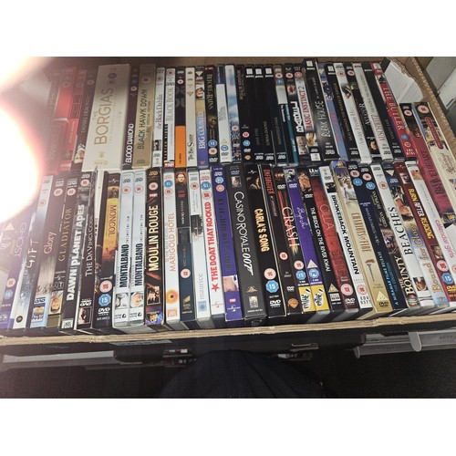 2638 - A large quantity of various DVDs and CDs, contents of 3 shelves