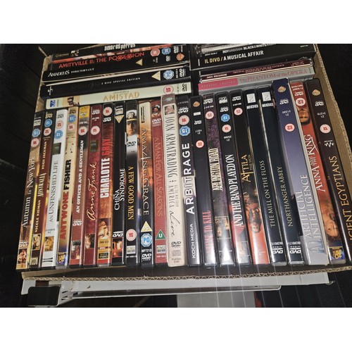 2638 - A large quantity of various DVDs and CDs, contents of 3 shelves