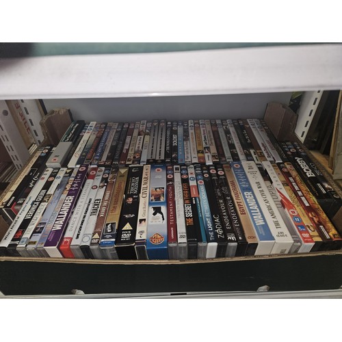 2639 - A large quantity of various DVDs and CDs, contents of 4 shelves