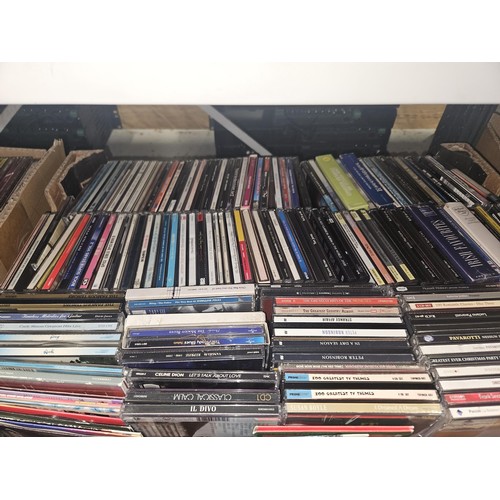 2640 - A large quantity of various DVDs and CDs, contents of 4 shelves