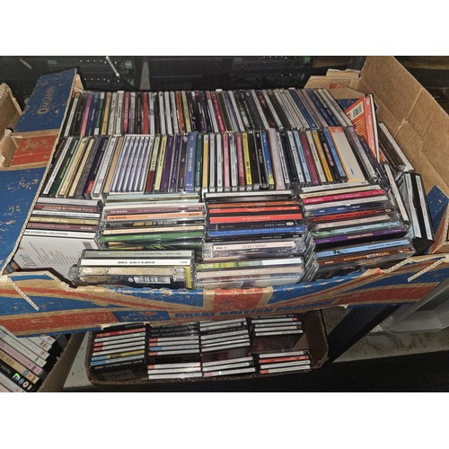 2640 - A large quantity of various DVDs and CDs, contents of 4 shelves