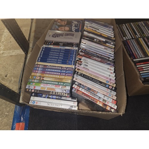 2640 - A large quantity of various DVDs and CDs, contents of 4 shelves