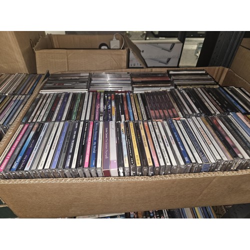 2641 - A large quantity of various DVDs and CDs, contents of 3 shelves