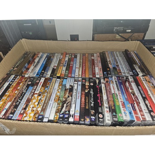 2641 - A large quantity of various DVDs and CDs, contents of 3 shelves