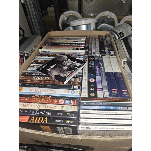 2642 - A large quantity of various DVDs and CDs, contents of 3 shelves