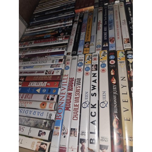 2642 - A large quantity of various DVDs and CDs, contents of 3 shelves