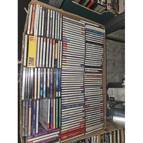 2642 - A large quantity of various DVDs and CDs, contents of 3 shelves