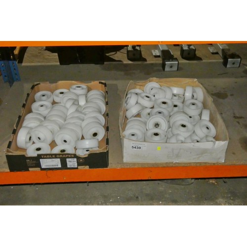 5430 - A quantity of white castor type wheels (wheels only, no fittings). Contents of 1 shelf