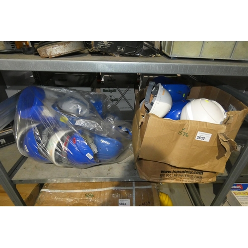 5802 - A quantity of various hard hats. Contents of 1 shelf