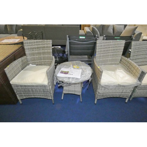 583 - A Sarenac polyrattan two person garden bistro set comprising of 2 x chairs and 1 x small round glass... 