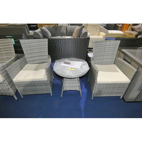 584 - A Sarenac polyrattan two person garden bistro set comprising of 2 x chairs and 1 x small round glass... 