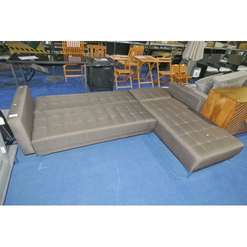 615 - A brown upholstered corner sofa / sofa bed overall approx 265 x 190cm. Please note both sections hav... 