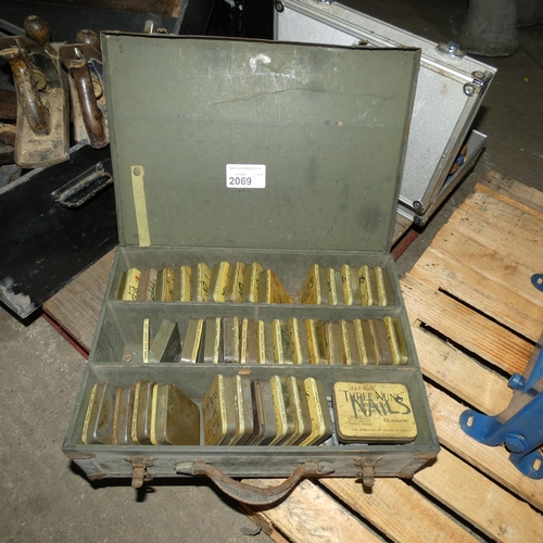 2069 - 1 x carry case with a quantity of vintage tabacco tins containing various nails, bolts etc