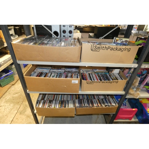 2327 - 6 boxes containing a quantity of various DVDs and CDs, contents of 3 shelves