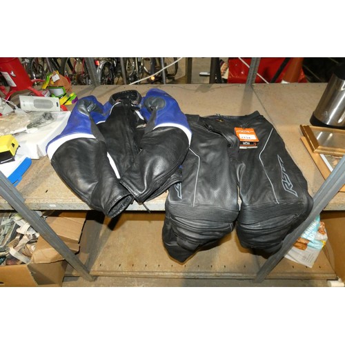 2134 - An RST leather motorcycle jacket size 46 and a set of RST leather motorcycle trousers size 40