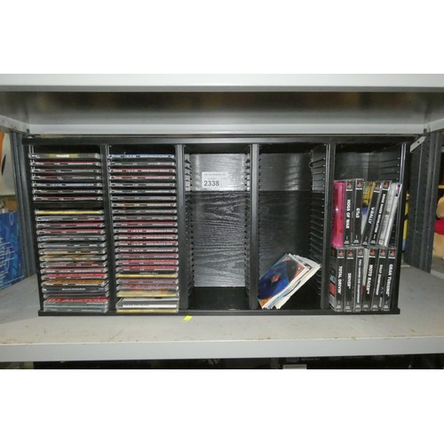 2338 - Cat alt - A quantity of various PlayStation 1 games and Demo discs in a CD rack please note hogs of ... 