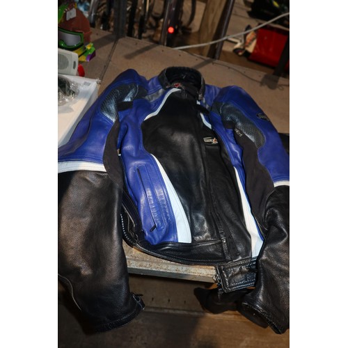 2134 - An RST leather motorcycle jacket size 46 and a set of RST leather motorcycle trousers size 40