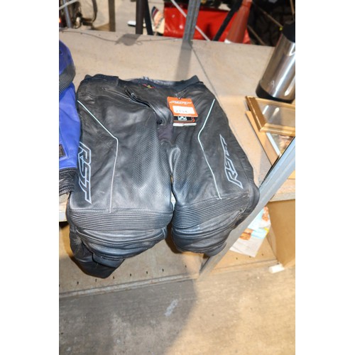 2134 - An RST leather motorcycle jacket size 46 and a set of RST leather motorcycle trousers size 40