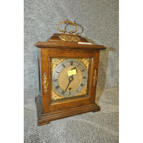 A small Oak cased rectangular mantle clock with Roman numerals