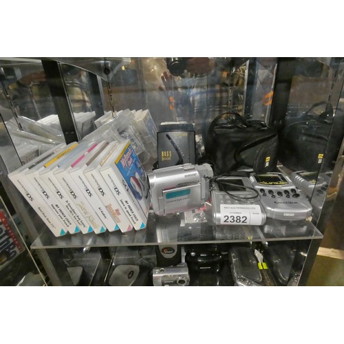 2382 - A quantity of various electronic related items including Nintendo DS games, a Sony Handycam type DCR... 