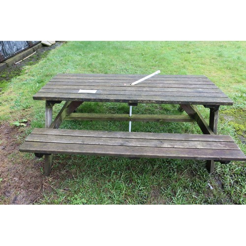 2537 - A wooden picnic table with fitted benches