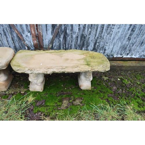 2538 - A wood effect concrete bench on 2 squirrel plinths