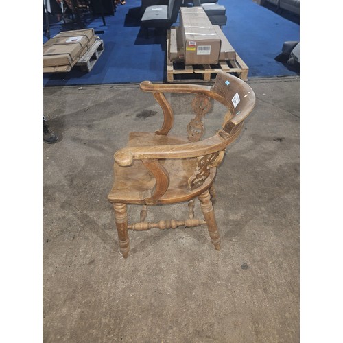 3377 - A vintage smokers bow chair with a wooden seat