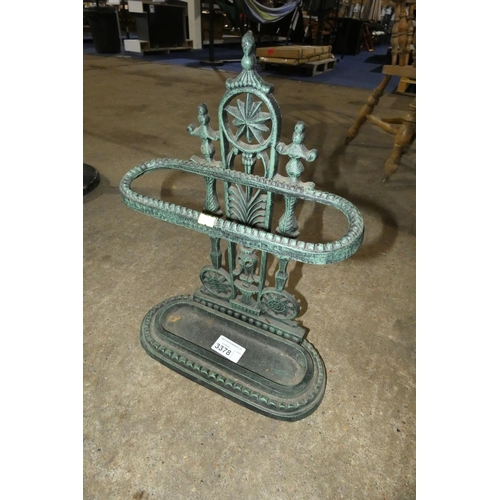 3378 - A decorative green painted cast iron umbrella stand with a drip tray