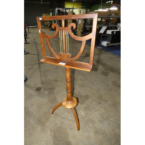 3379 - A vintage mahogany adjustable music stand with a tripod base