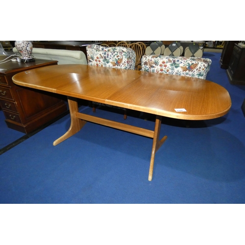 3394 - A 1970s vintage Mcintosh light wood oval-ended extending dining table with folding centre leaves