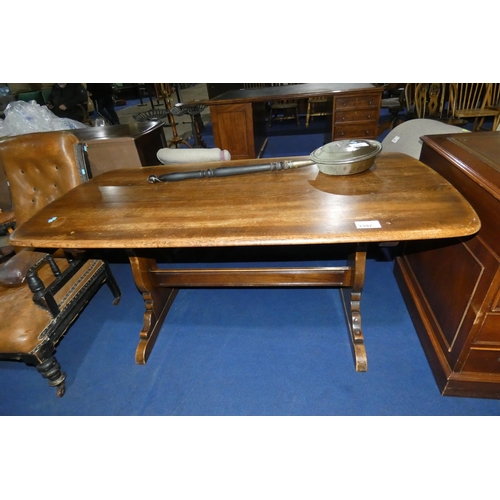 3397 - An Ercol dark wood rectangular topped dining table with trestle supports