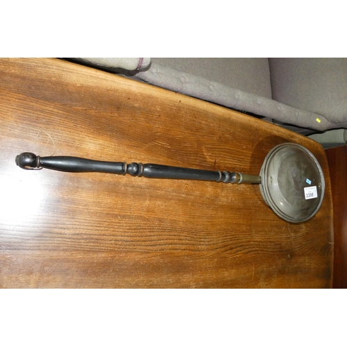 3398 - A vintage copper warming pan with a turned wood handle