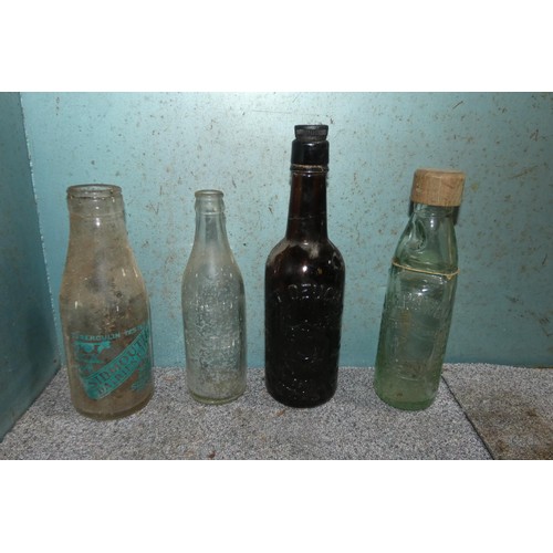 46 - A quantity of various vintage glass bottles, contents of one shelf