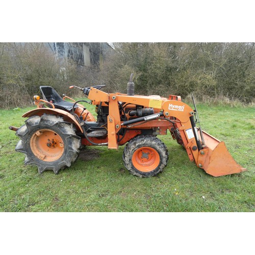 142 - A Kubota B7001, starts runs and drives, comes with Hymari power loader and a 3.5ft bucket, hours not... 