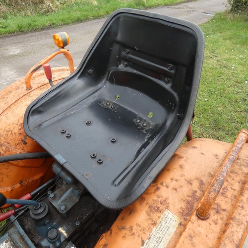 142 - A Kubota B7001, starts runs and drives, comes with Hymari power loader and a 3.5ft bucket, hours not... 